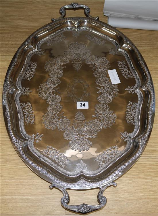 A late Victorian silver plated two handled tea tray, 26.5in.